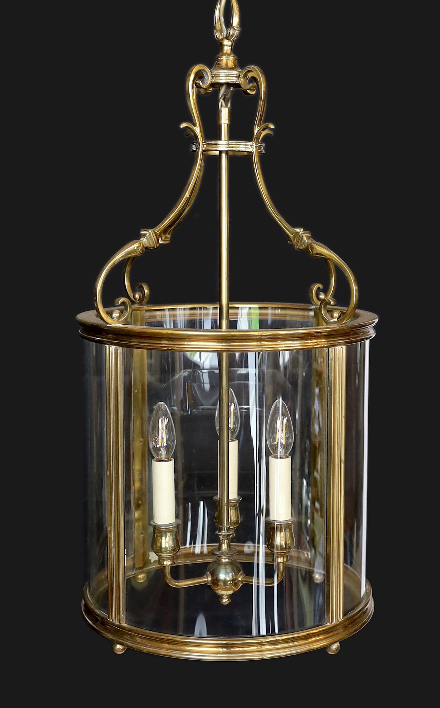 A large Georgian style brass hall lantern with internal bulb holder, height 79cm. diameter 38 cm